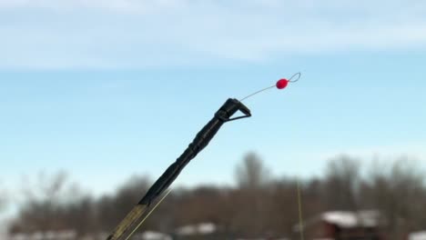 the tip of an ice fishing rod - close up