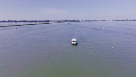 a tranquil moment captured from above, featuring a dutch luxemotor vessel on open water