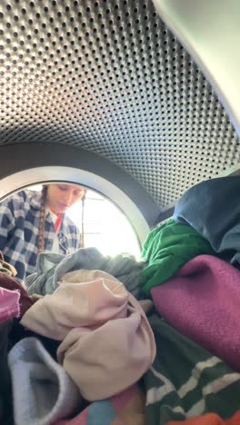 loading laundry into a washing machine