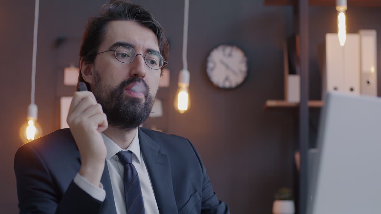 Businessman Vaping During Video Call