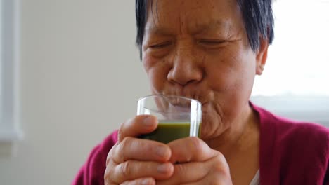 senior woman having juice