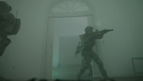 group of men in camouflage uniform playing airsoft indoor