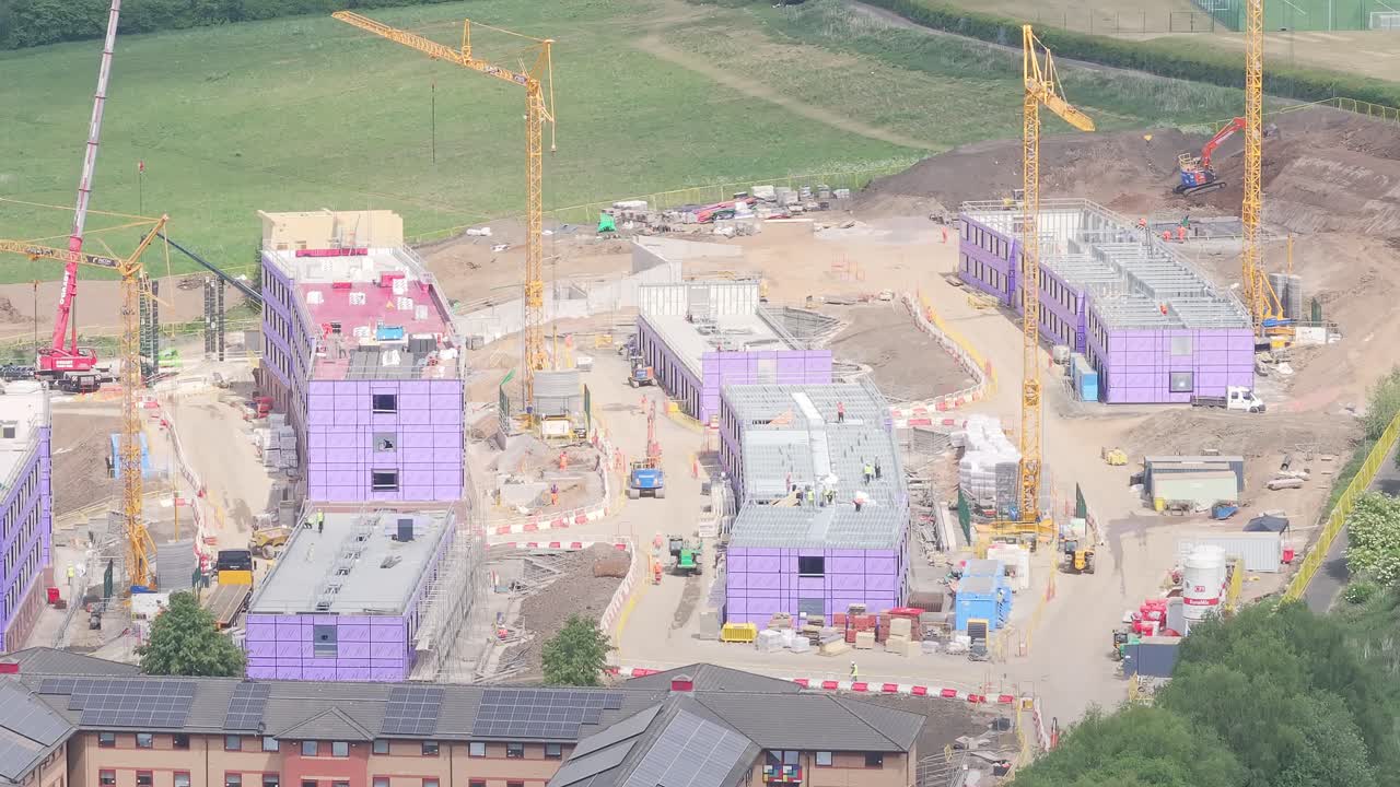 Construction progresses at Stoke-on-Trent’s Goods Yard site, with insulated structures, cranes, and solar-equipped buildings reflecting sustainable redevelopment in England’s West Midlands
