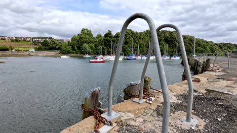 dockside with boats and scenic background