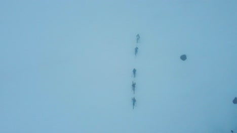 top shot skiers on the glacier climb the silvretta mountains in switzerland