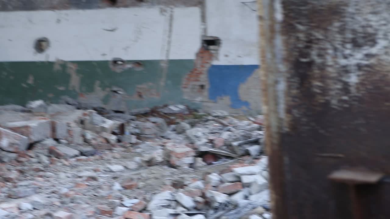 Frightened boy runs through an abandoned territory