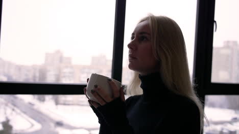 blonde woman drinking tea