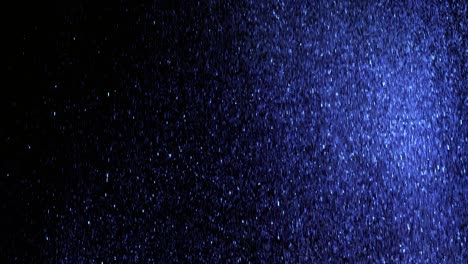 the beautiful falling of glittering particles. slow motion