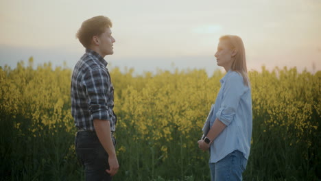 Farmer-And-Agronomist-Discussing-By-Plants-In-Farm