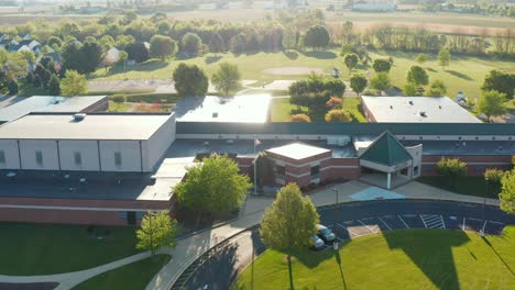 Descending-aerial-of-exterior-of-American-school