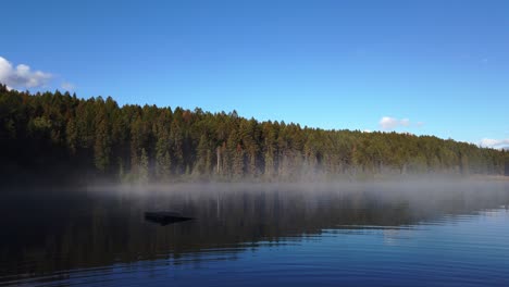 Lake-mist-on-shore-with-broken-dock-floating-Enid-British-Columbia-Canada