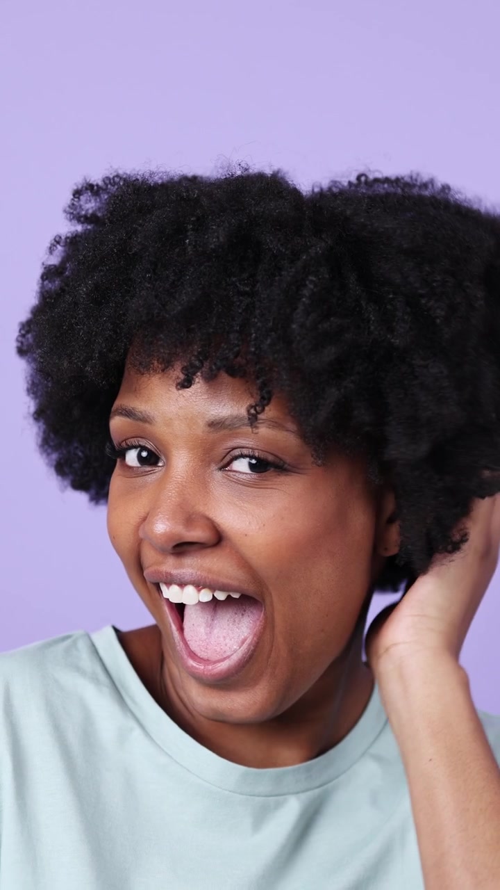 Happy African American Woman with Natural Hair Laughing and Smiling