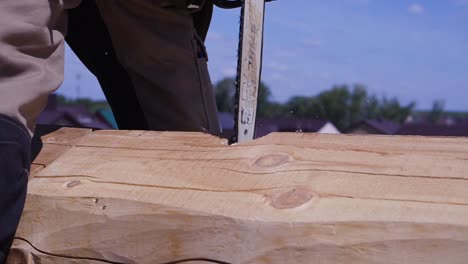 chainsaw cutting wood for construction