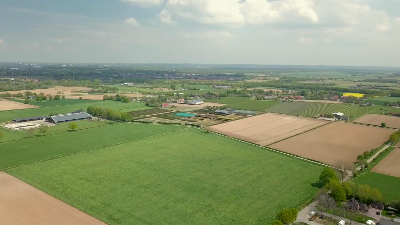 Aerial drone view of the beautiful flat landscape in the countryside of the Netherlands