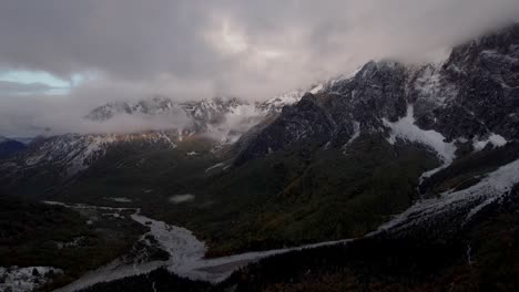 dramatic mountain winter scenery of alps with snow and clouds over valbona valley in albania
