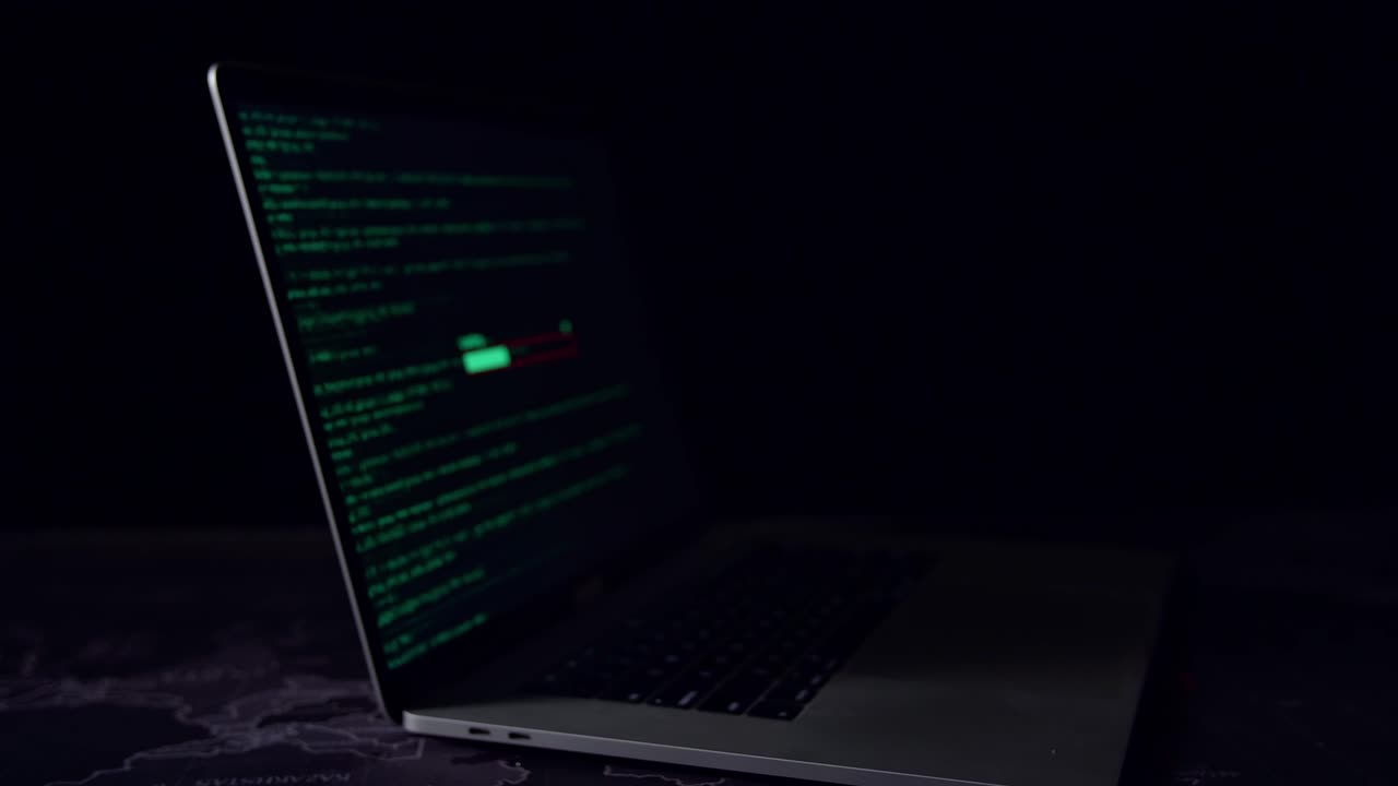 Display Of Laptop Computer Hacking And Downloading Data In The Dark Room