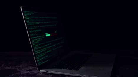 display of laptop computer hacking and downloading data in the dark room