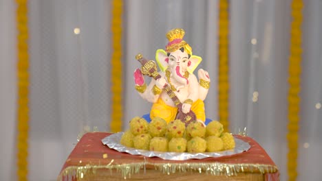 ladoo sweet in front of lord ganesh