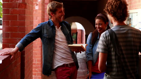 Students-standing-in-the-hallway-chatting