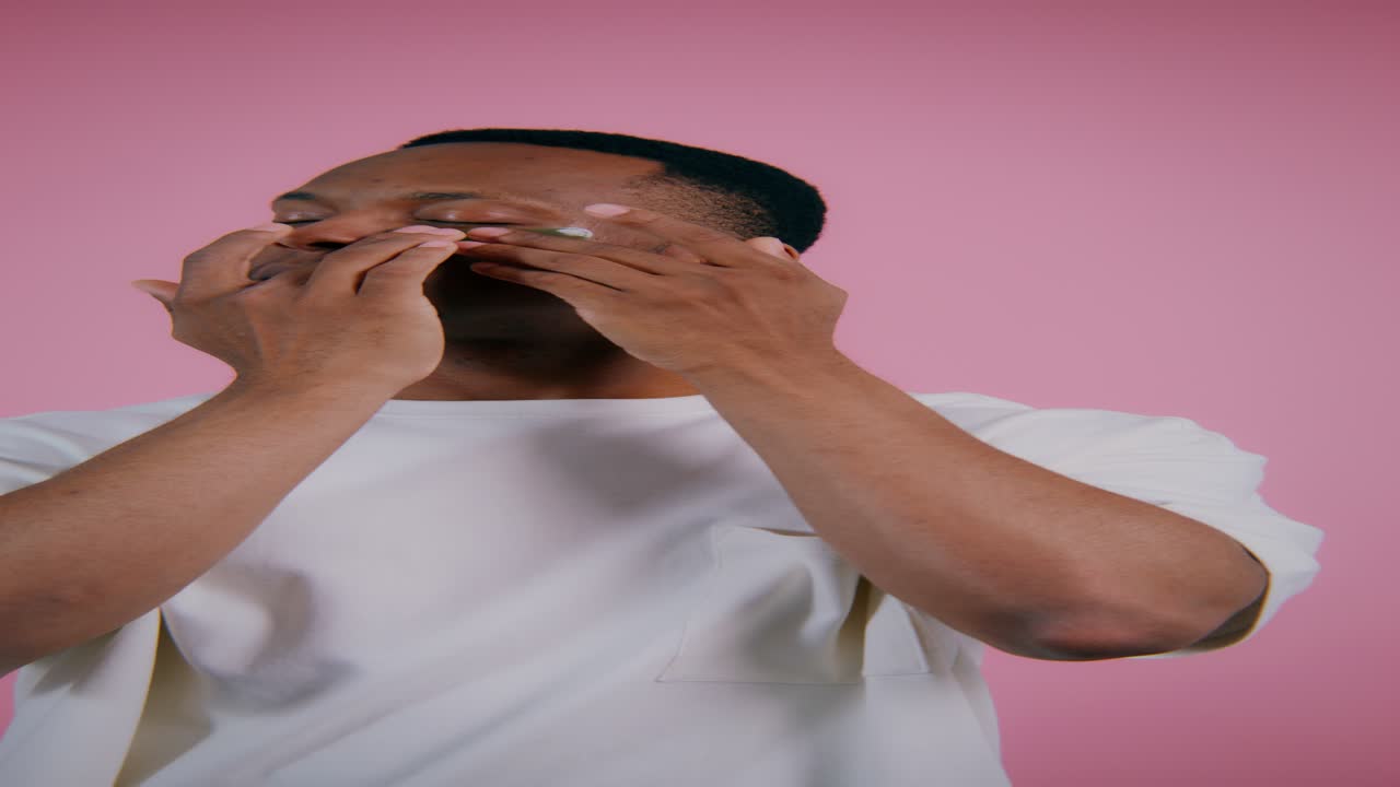Man applying eye masks