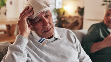 elderly man experiencing discomfort at home