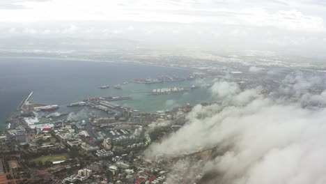 long aerial shot of clouds hovering over cape town, south africa