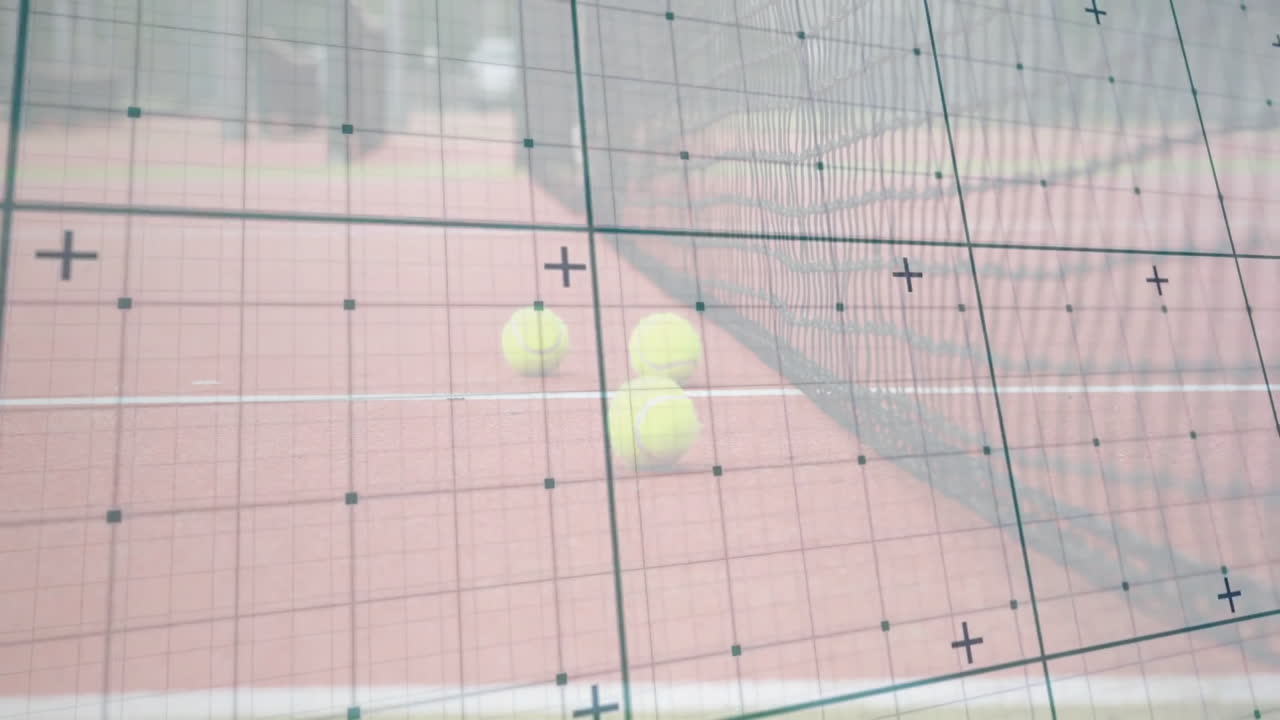Two yellow tennis balls appearing on clay court, showing translucent grid with calibration markers