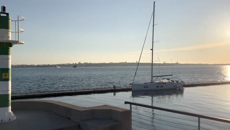 Yacht-docked-in-marina-of-Setubal-Portugal-overlooking-the-Troia-peninsula