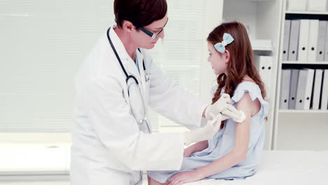 patient receiving injection from doctor