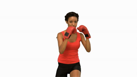 woman boxing on white screen in slow motion