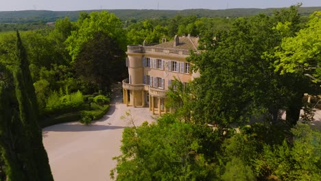 aerial establishing shot of the chateau de castille in the uzes countryside