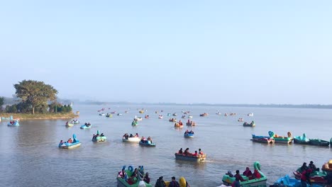 people are enjoying boating in the lake of chandigarh, india