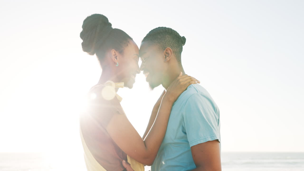 Couple in Love on the Beach at Sunrise/Sunset