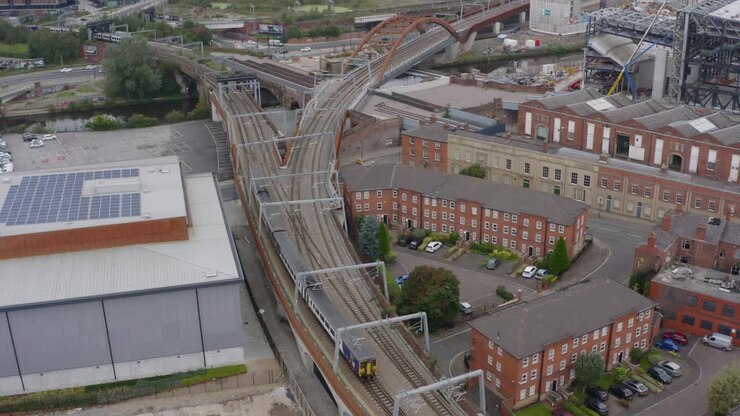 Drone Shot Tracking Train Travelling Through Castlefield Canals 06