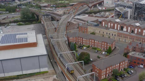 drone shot tracking train travelling through castlefield canals 06