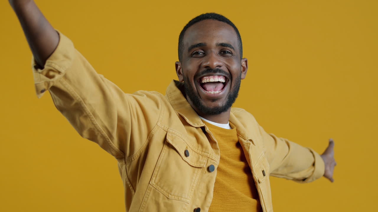 Man Posing in a Yellow Jacket