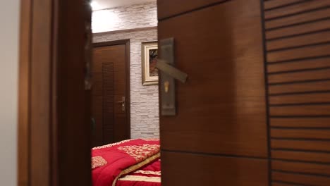 Unveiling-door-into-luxury-master-bedroom-with-modern-furniture