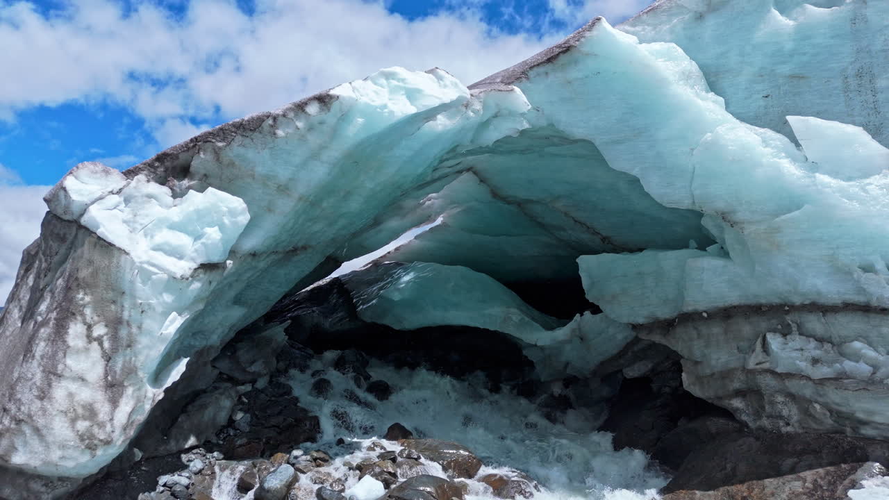 Ice cave at Morteratsch Glacier showcasing rugged, serene natural beauty