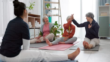 Senior-yoga,-high-five-and-women-in-a-class