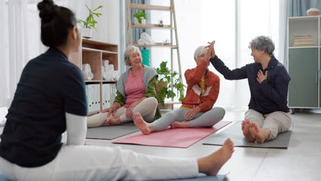 senior yoga, high five and women in a class