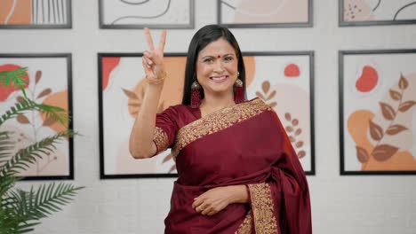 Indian-woman-showing-victory-sign