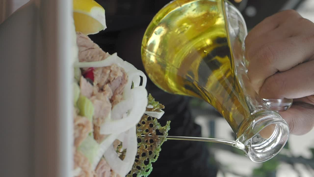 Tuna salad preparation with olive oil