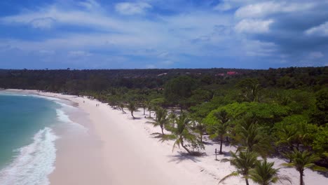 long set beach in koh rong island, featuring turquoise waters, white sand beache and lush tropical vegetation. lovely aerial view flight fly reverse overflight flyover drone