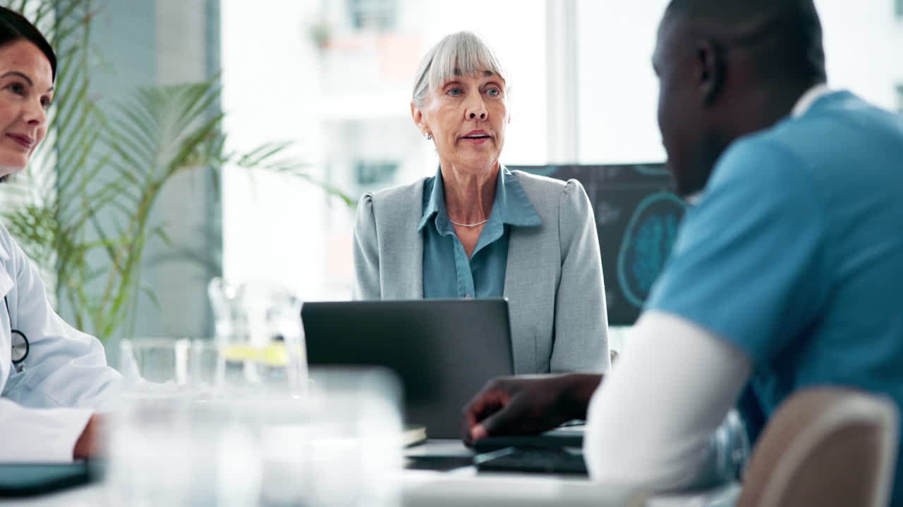 Doctors and businesswoman in a meeting