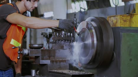 construction worker wear hard hat safety in the industry factory. machine is working on grinding metal or steel. concept industrial machinery and engineering