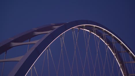 two-axial-tied-arches-are-placed-in-parallel-alongside-the-deck-closeup-architectural-joints-and-seams-holding-up-Korean-metals-with-deck-lies-in-between-the-arches-and-LED-fluorecent-framed-lights