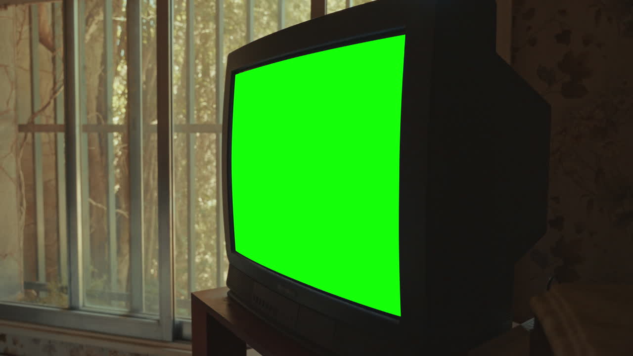 Old CRT Television with Green Screen in a Vintage Room