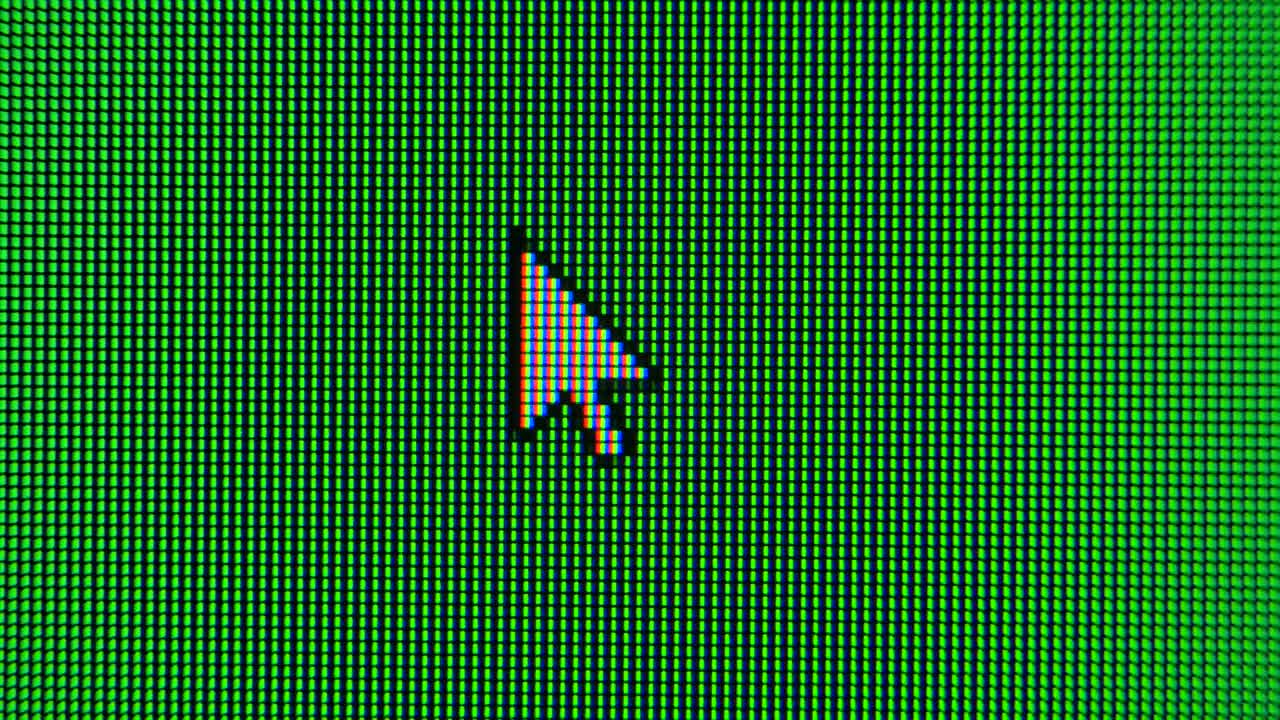 The cursor arrow moves across the green screen and highlights an area. Screen monitor pixels close up