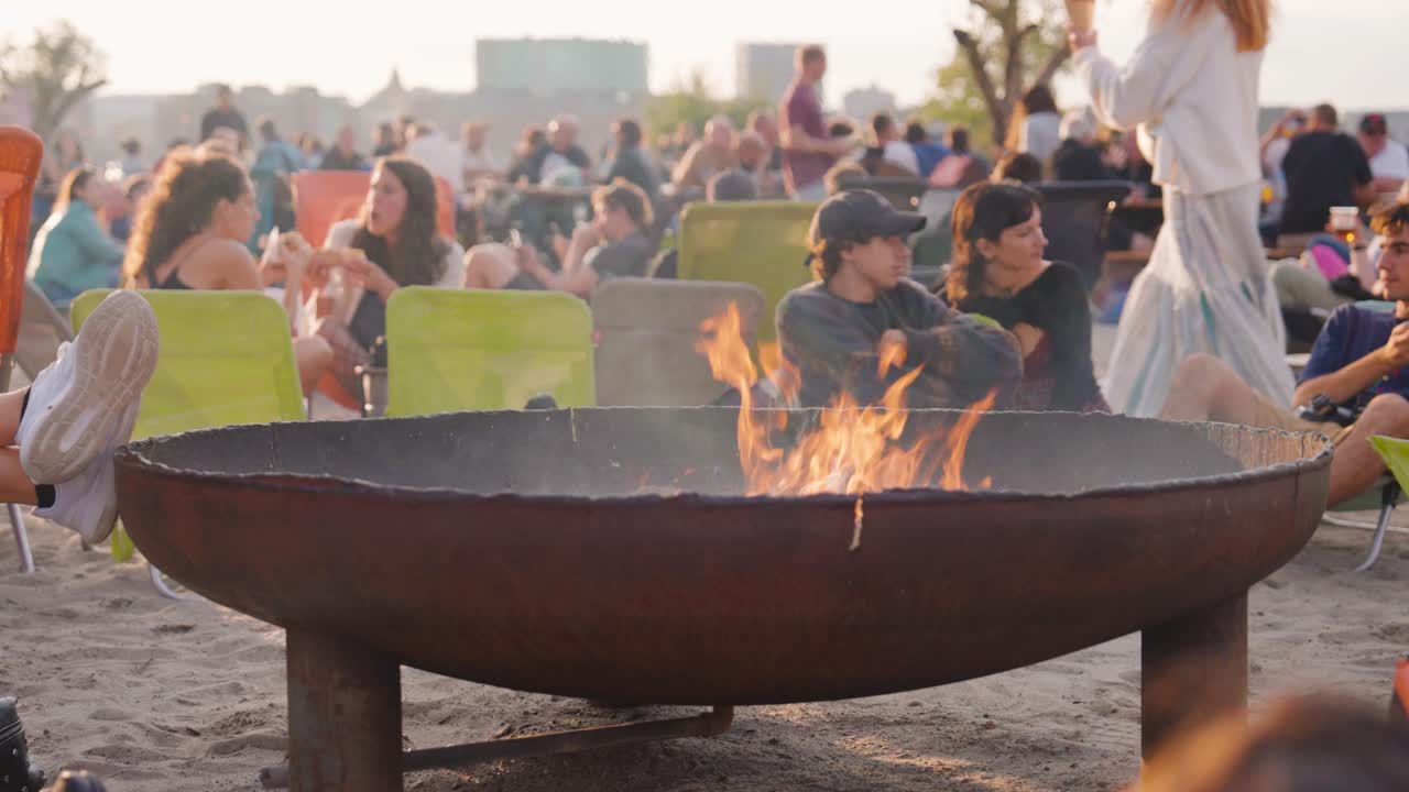Friends Enjoying a Bonfire on the Beach at Sunset
