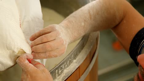 Male-worker-preparing-gin-in-distillery-at-factory-4k